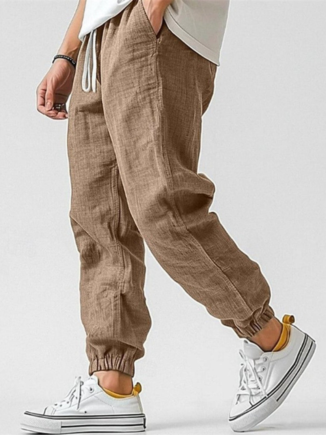 Men's linen blend jogger pants with tapered fit, drawstring waist, and elastic cuffs for casual comfort.