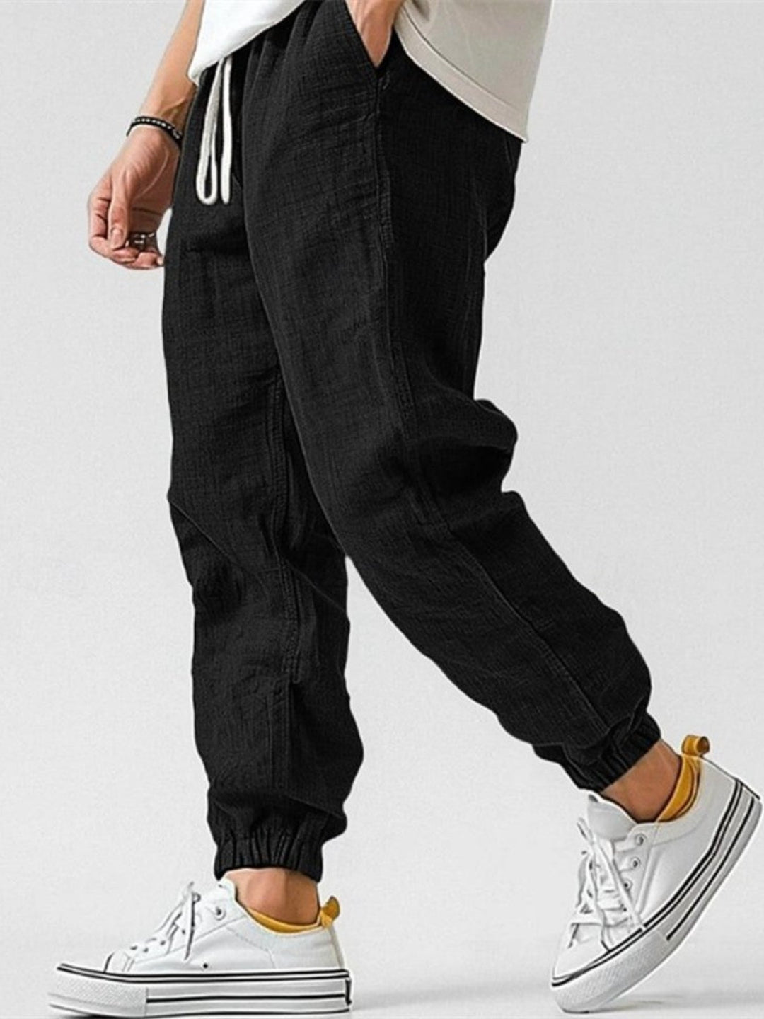 Black men's tapered fit linen blend jogger pants. Perfect comfortable lounge bottoms with elastic cuffs.
