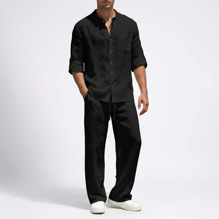 Relaxed fit men's linen two-piece set with mandarin collar shirt & comfortable drawstring pants.