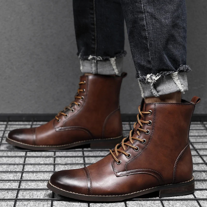 Men's Lisbon Classic ankle boots in black, styled with jeans for a casual yet sophisticated everyday look.