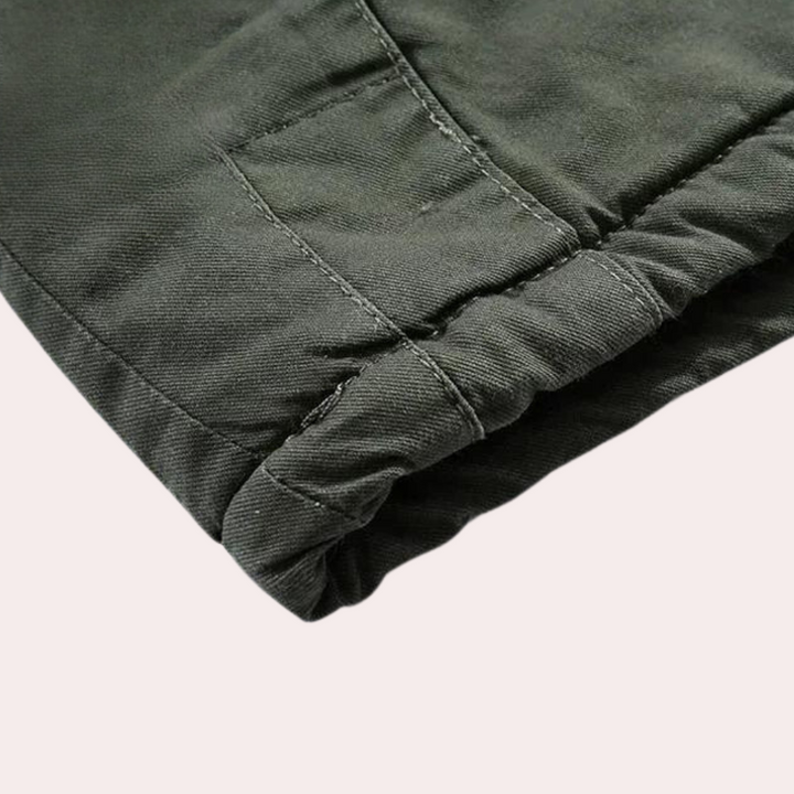 Stylish men's Logan winter jacket, a padded outdoor coat with a warm hood for ultimate cold weather comfort.