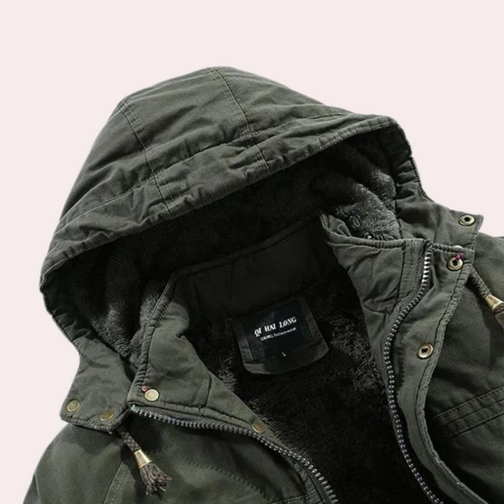 Men's Logan winter coat, a padded jacket featuring a warm hood, essential for harsh cold weather protection.