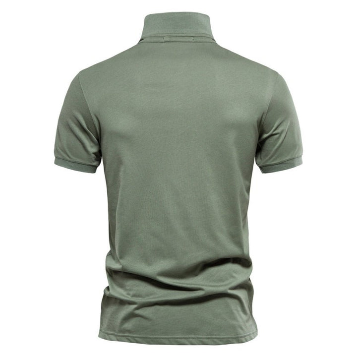 Man wearing the Men's Logan Polo Shirt, demonstrating its smart casual fit & comfortable feel.
