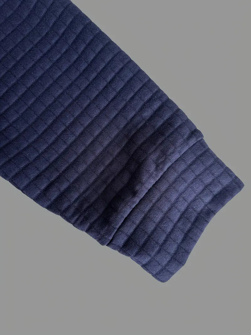Stylish long sleeve polo for men, featuring a button placket, textured fabric, and sleeve pocket.