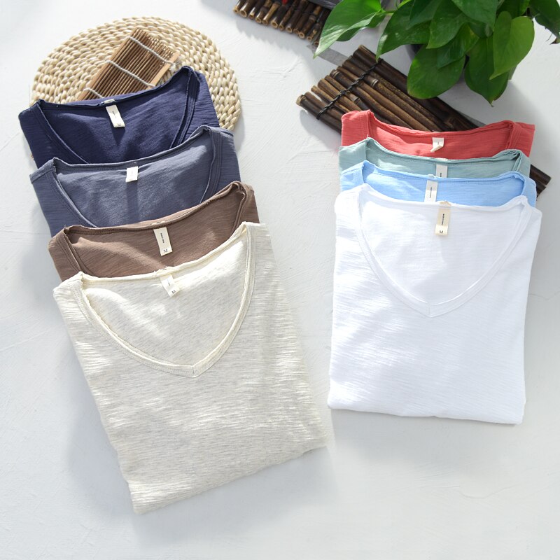 White men's V-neck linen shirt with short sleeves, a staple for summer fashion and comfort
