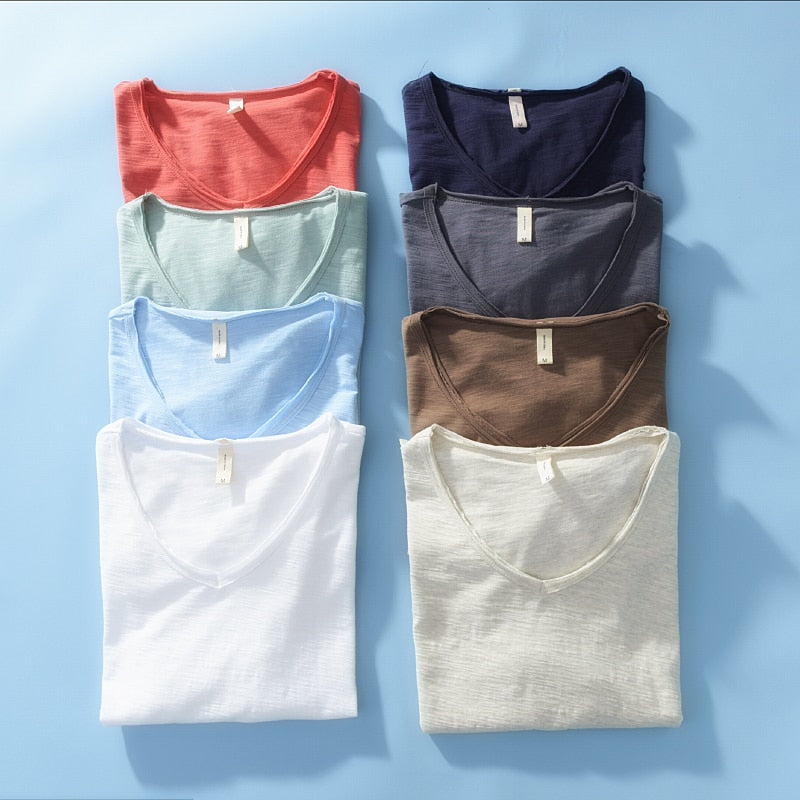 Man enjoying the summer in a breathable white V-neck linen blend short sleeve shirt