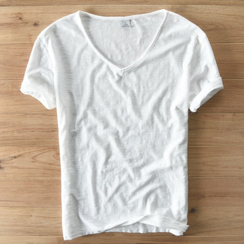 Studio shot of a men's white V-neck linen blend shirt, highlighting its modern slim fit