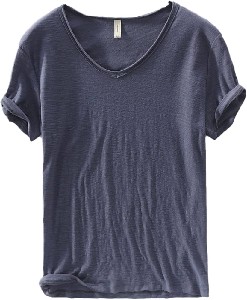 Close-up of the fabric texture of a men's white V-neck linen blend shirt, showing breathability