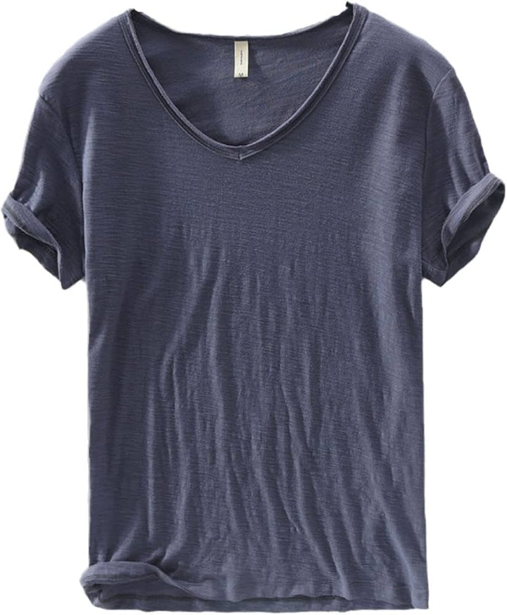 Close-up of the fabric texture of a men's white V-neck linen blend shirt, showing breathability