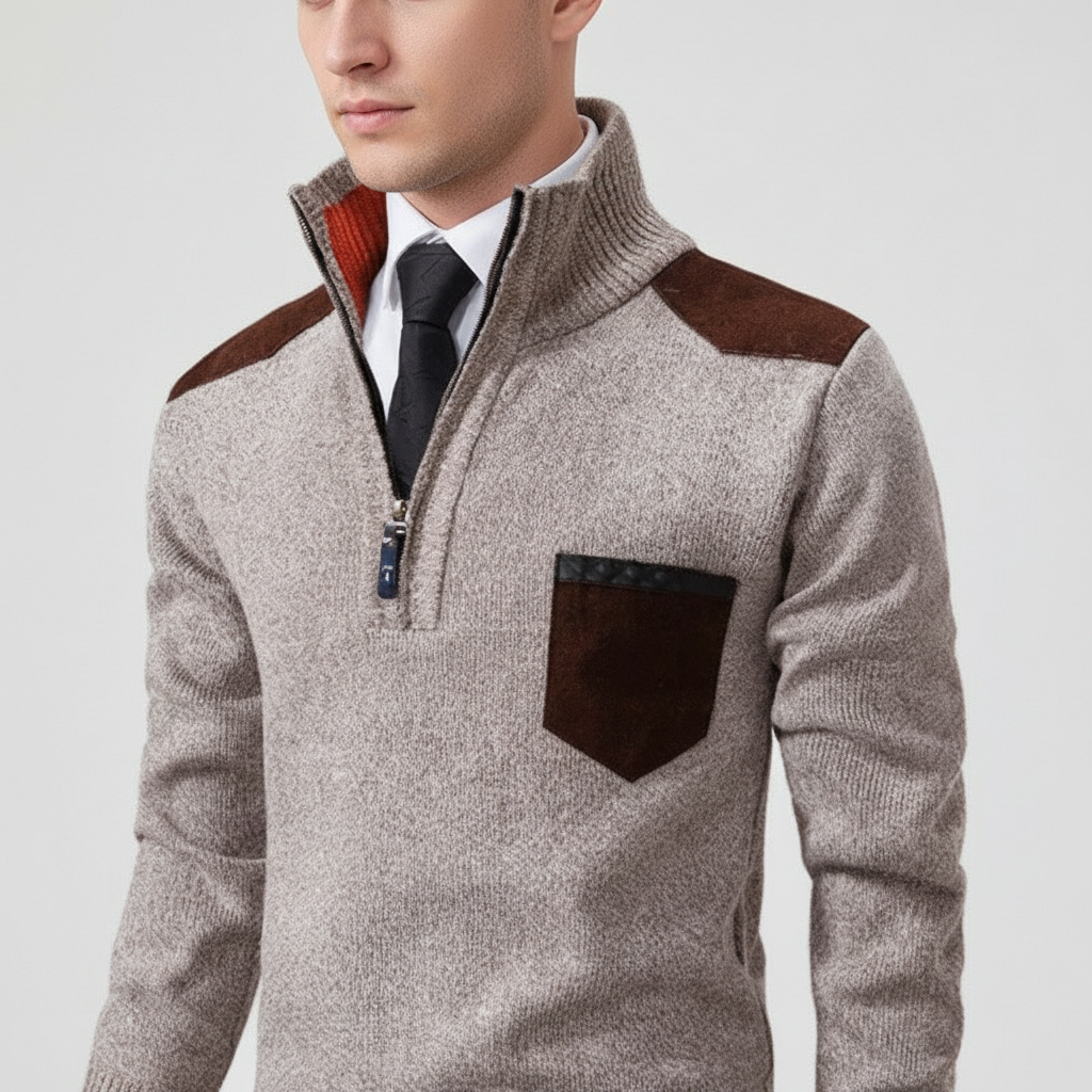 Men's grey cashmere quarter-zip jumper paired with trousers, demonstrating casual elegance.