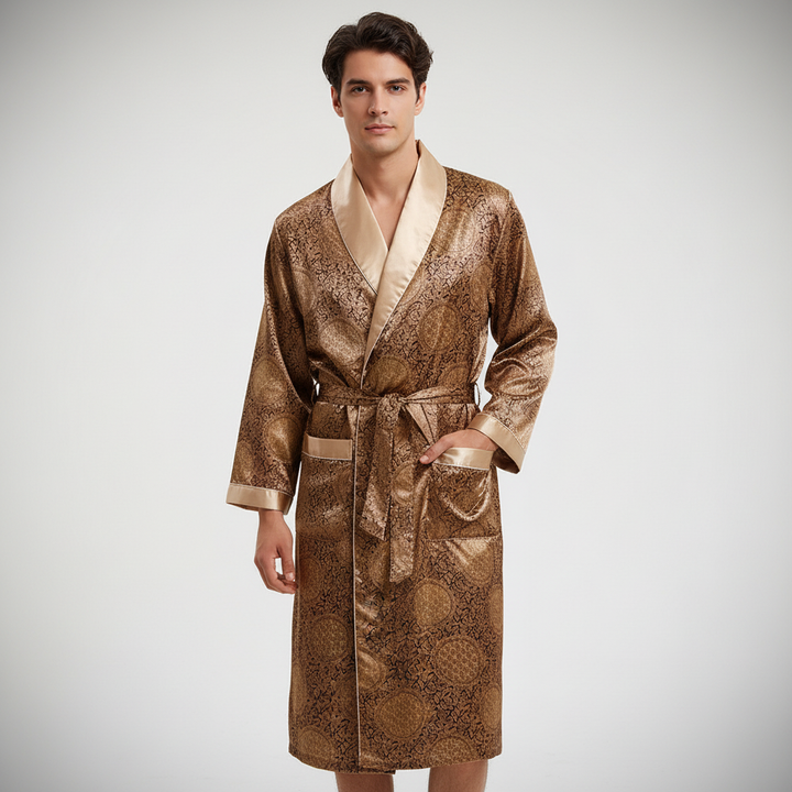 Men's luxurious black satin bathrobe with intricate gold pattern and sash, ideal for loungewear.