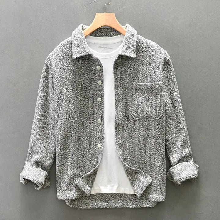Stylish men's boucle knit overshirt. Comfortable, textured long-sleeve button-down. Ideal for smart-casual layering.