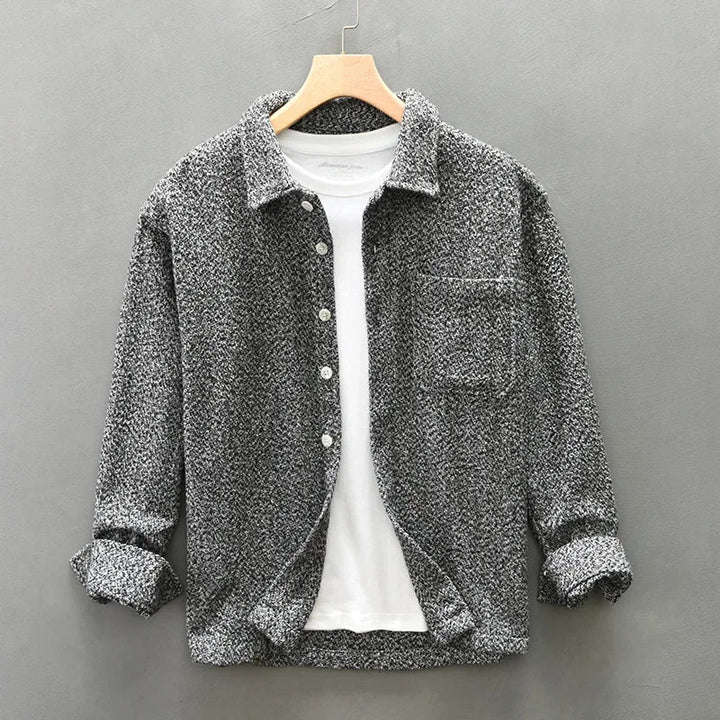 Luxurious men's boucle-knit overshirt. Soft, elegant textured fabric, button-down long-sleeve. Perfect for modern fashion.