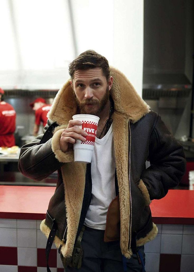 Man wearing stylish, versatile men's luxury outerwear jacket, perfect for sophisticated fall/winter style.
