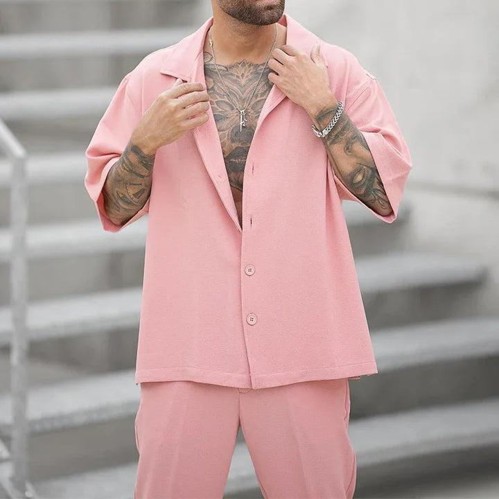 Close-up of men's luxury button shirt from the elegant two-piece set, showcasing quality fabric and design.