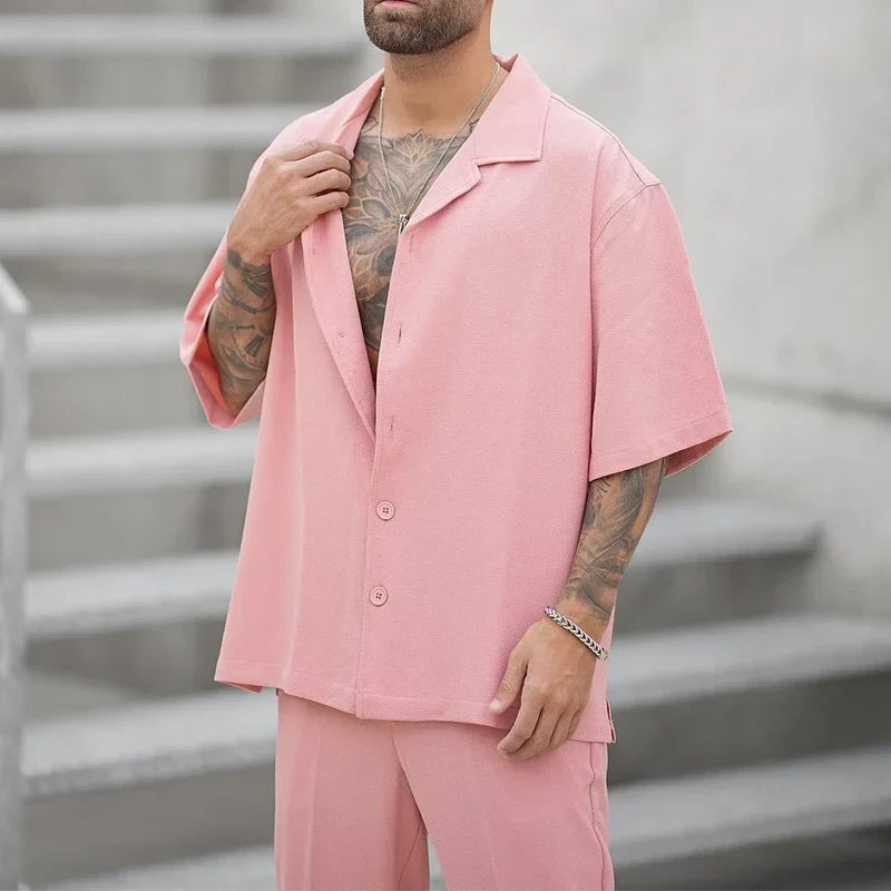 Complete men's two-piece outfit: a sleek button shirt and matching pants, ideal for luxury men's fashion.