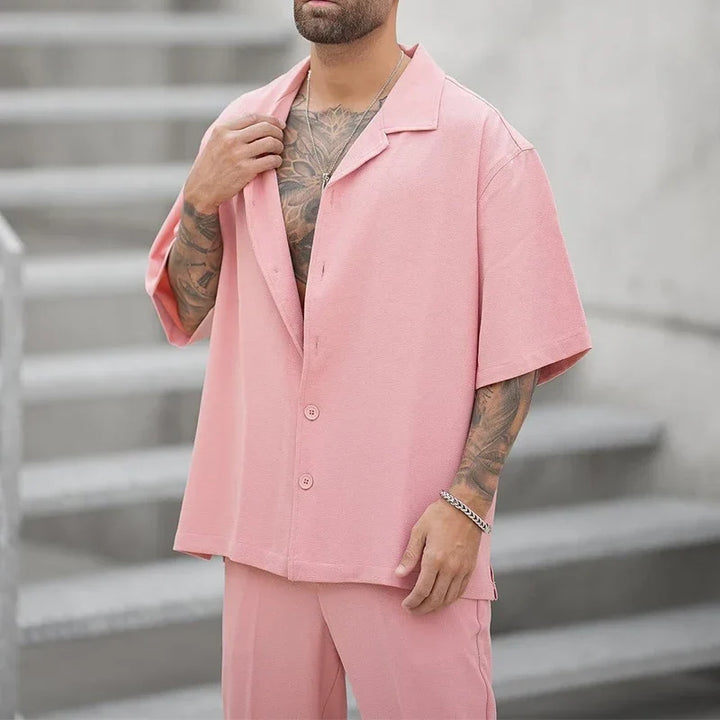 Complete men's two-piece outfit: a sleek button shirt and matching pants, ideal for luxury men's fashion.