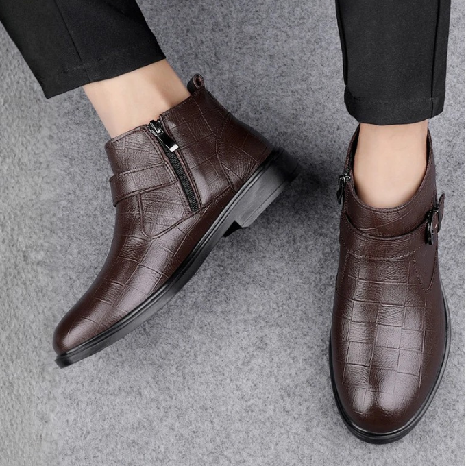Black full-grain leather men's dress boots. Sleek, stylish, and durable for formal occasions.