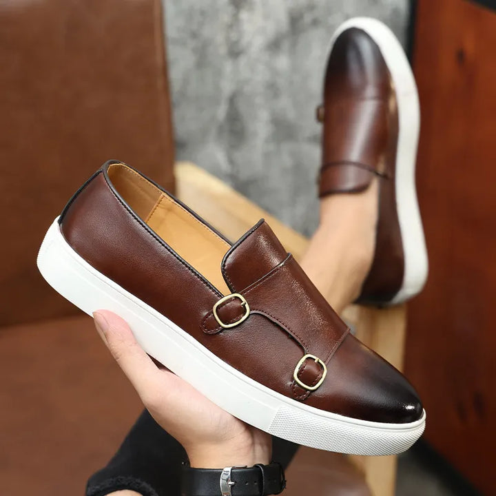 High-quality men's black leather dress shoes with polished buckle, suitable for office and events