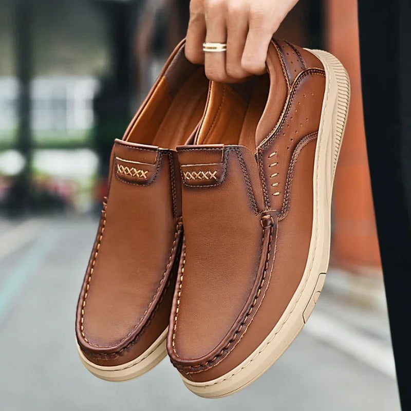Versatile men's Madison leather slip-on loafers, suitable for both formal dress and casual office wear.