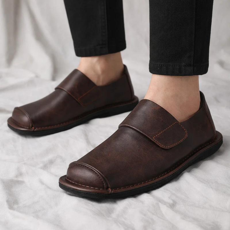 Stylish black Mayfair men's slip-on loafers, perfect for versatile everyday wear & dressy casual occasions.