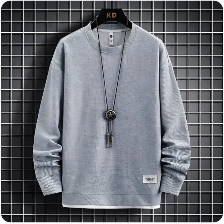Menswear relaxed fit lounge set with joggers and a comfortable sweater. Stylish two-piece casual tracksuit.