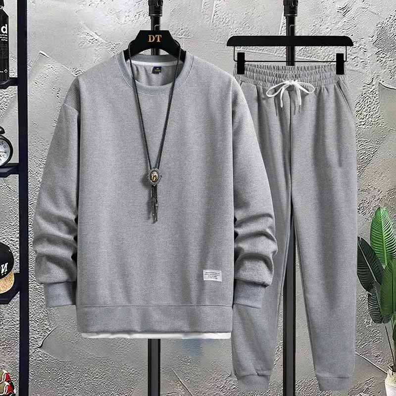 Men's comfortable two-piece set: relaxed fit sweater and matching joggers for ultimate casual comfort.