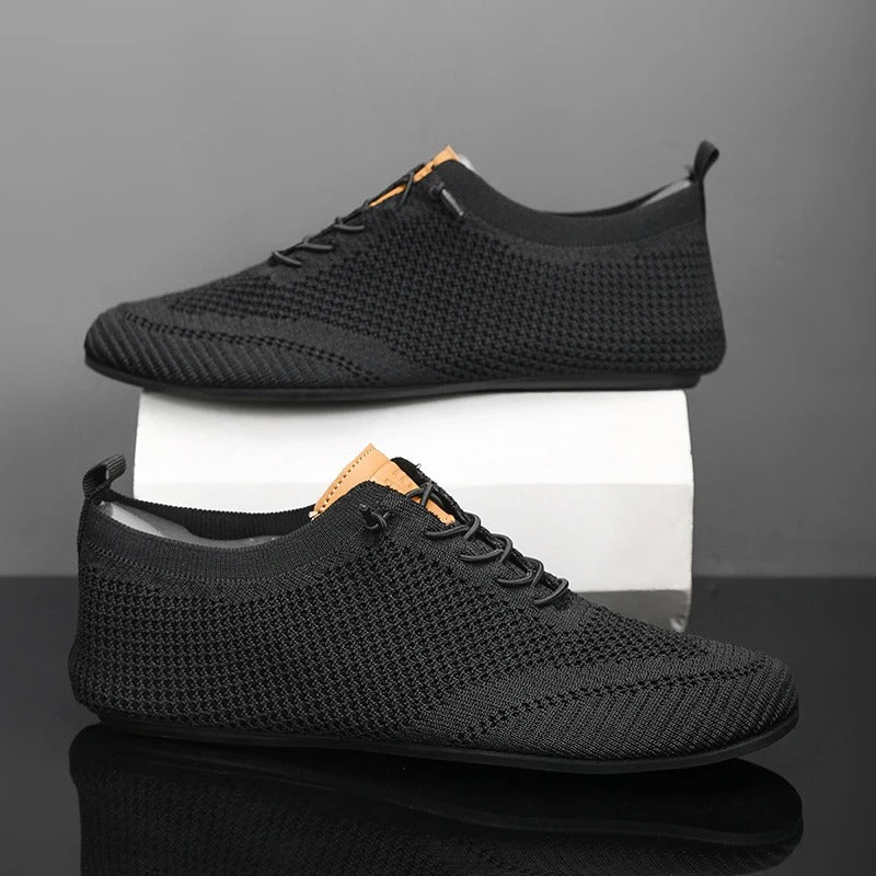 Back view of men's everyday comfort slip-on sneakers, knit upper for easy wear.