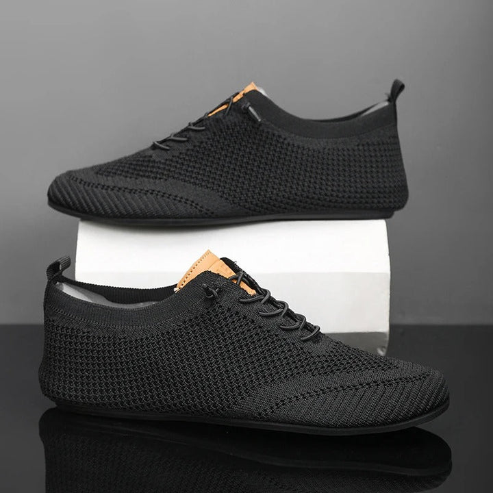 Back view of men's everyday comfort slip-on sneakers, knit upper for easy wear.