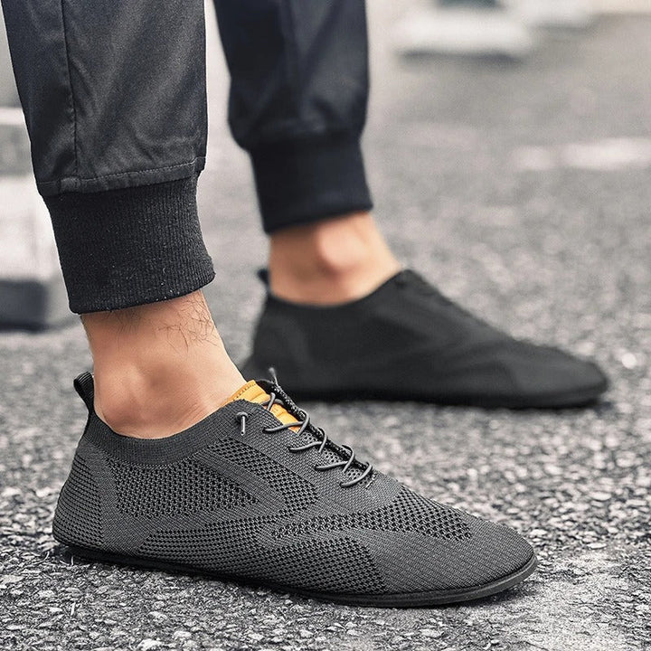 Men's lightweight slip-on sneakers with comfort sole, breathable mesh knit upper for walking.