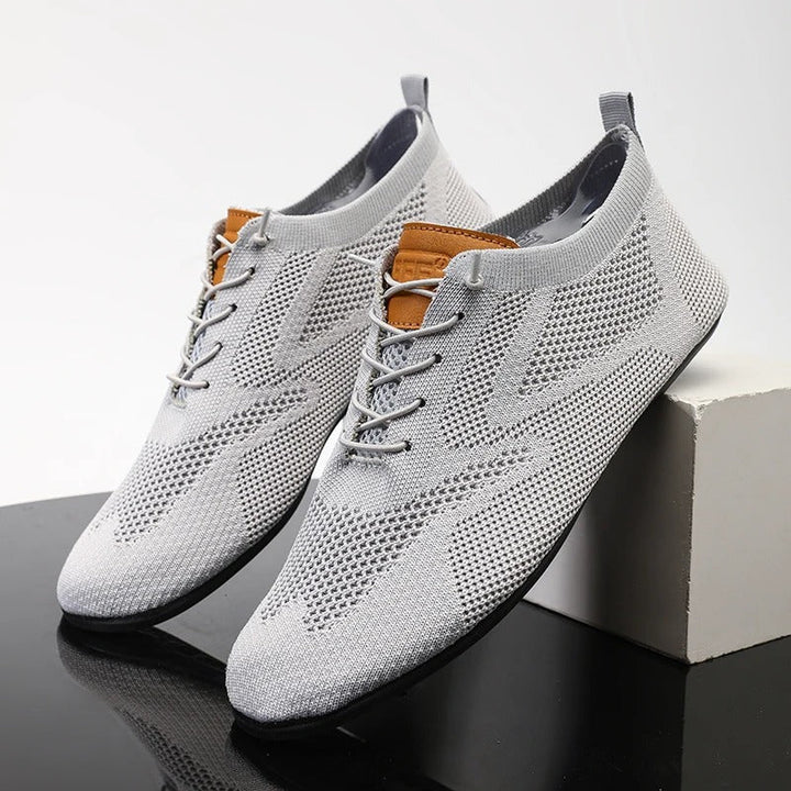 Men's breathable slip-on walking shoes, knit sneakers for lightweight athletic comfort.