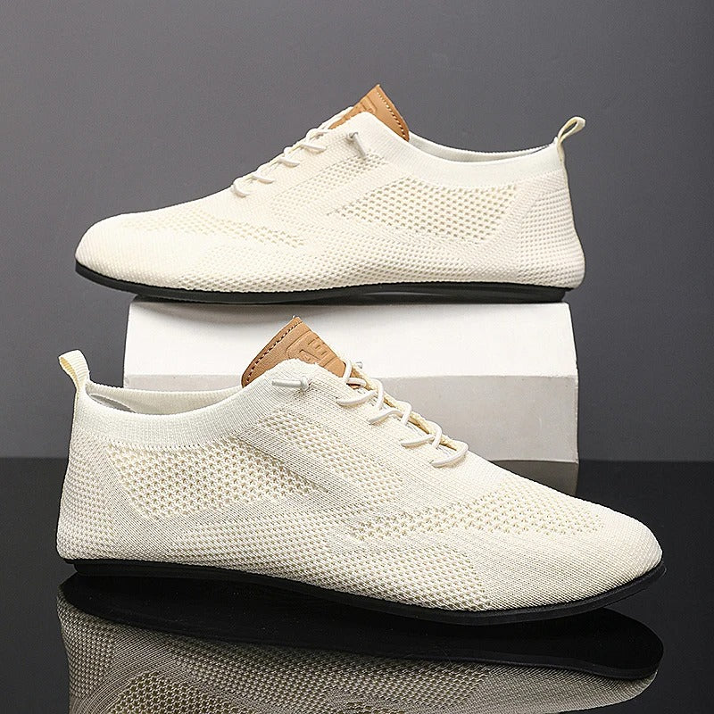 Grey men's mesh knit slip-on sneakers, lightweight & breathable for ultimate comfort walking.