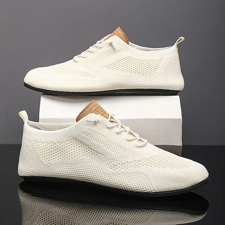 Grey men's mesh knit slip-on sneakers, lightweight & breathable for ultimate comfort walking.