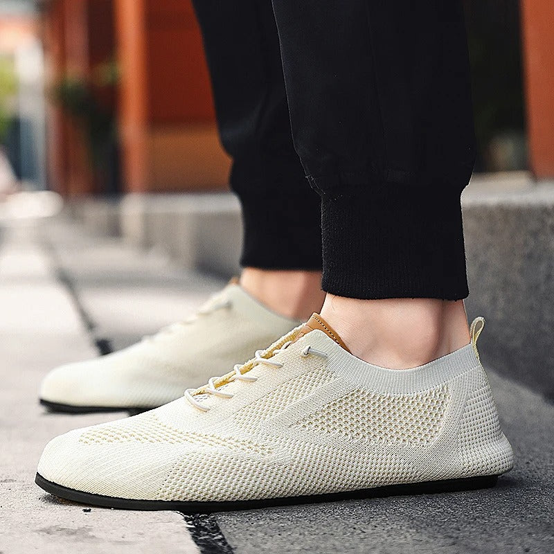 Blue men's slip-on knit sneakers, perfect for lightweight comfort and casual everyday style.