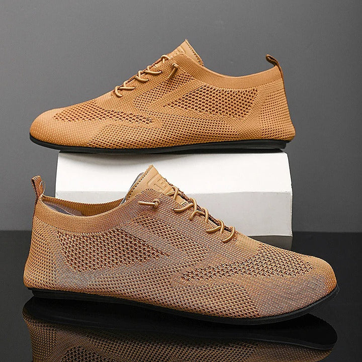 Durable men's mesh knit slip-on sneakers, designed for daily comfort & lightweight wear.