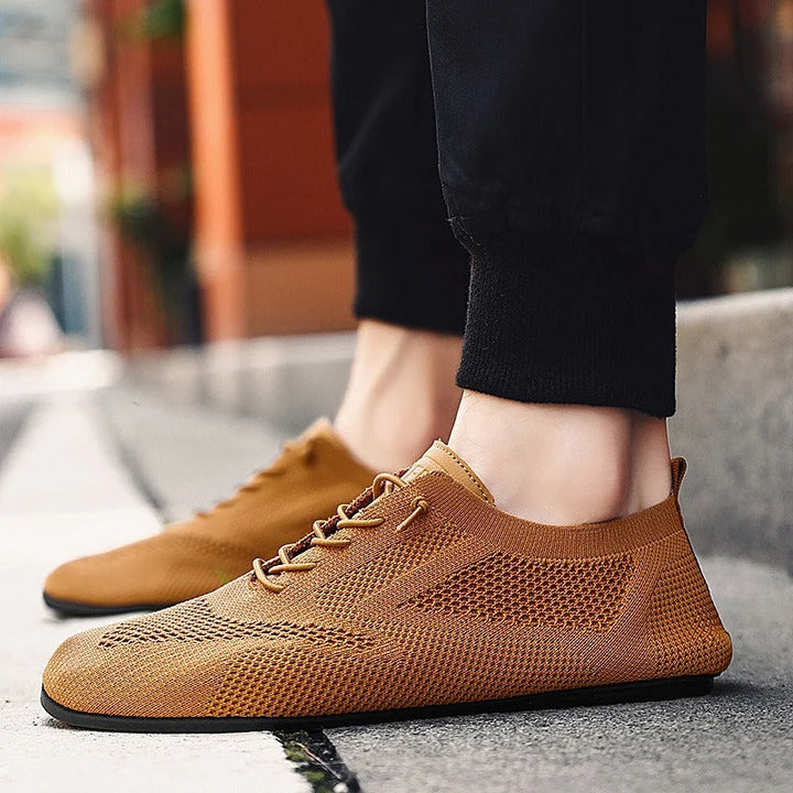 Easy slip-on men's comfort shoes, lightweight mesh knit sneakers for breathable everyday wear.