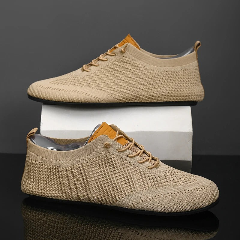 Front view of men's slip-on casual sneakers, mesh knit for lightweight, breathable comfort.