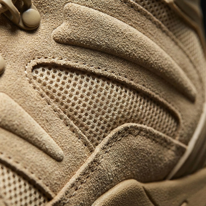 Rugged men's mid-cut tactical hiking boots for camping, hiking, and challenging outdoor terrain.