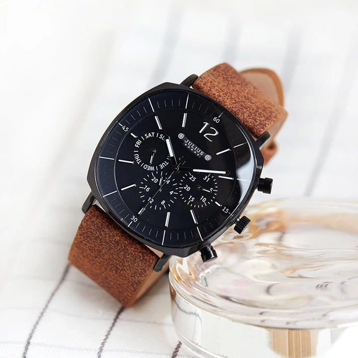 Midnight Eclipse men's chronograph watch featuring a dark blue dial and comfortable brown leather strap. Quartz movement.