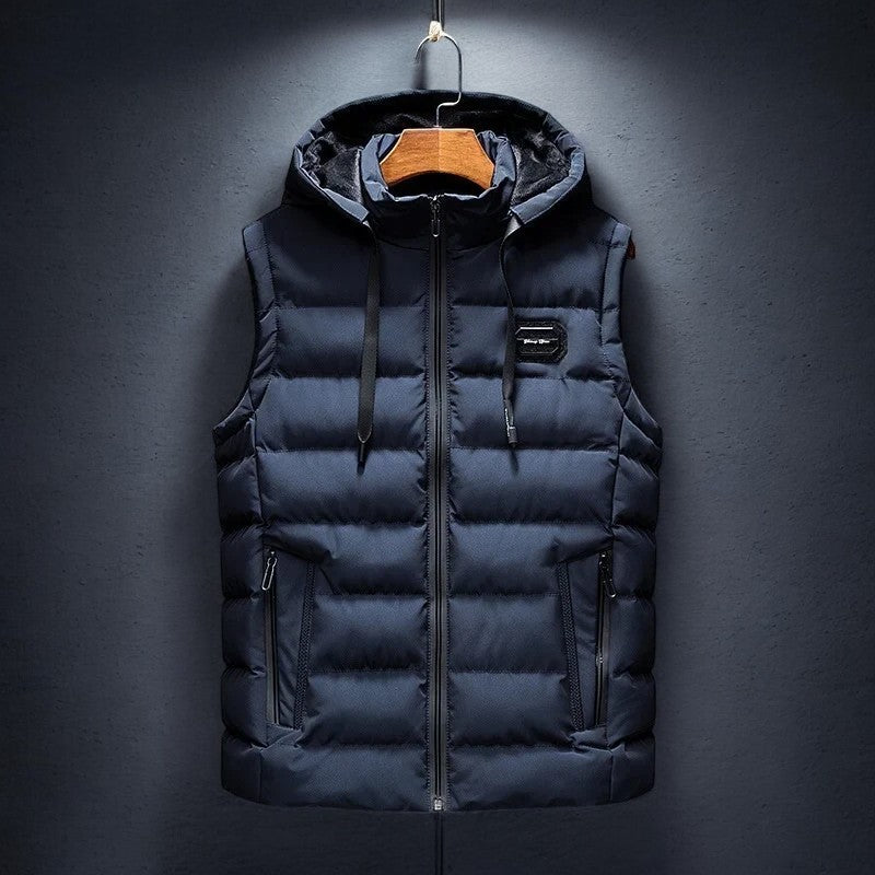 Man wearing a Midtown hooded puffer vest, ideal for active, casual, and comfortable athleisure style in fall/winter.