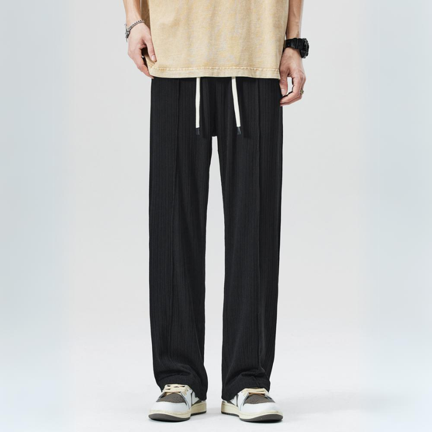 Stylish green Milano pleated trousers for men. Comfortable elastic waist design, ideal for modern fashion.