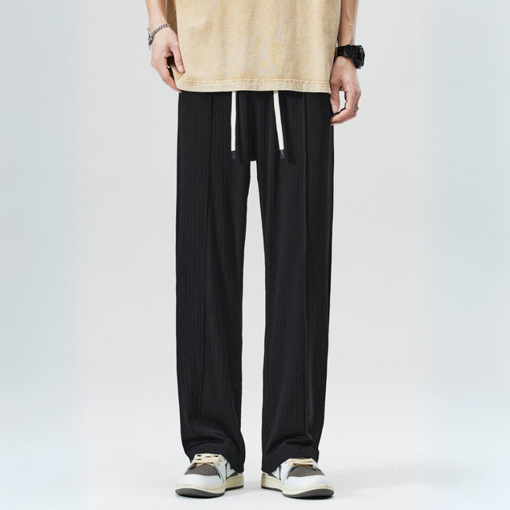 Stylish green Milano pleated trousers for men. Comfortable elastic waist design, ideal for modern fashion.