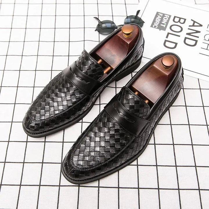 Classic men's slip-on loafers featuring a detailed woven design, offering elegant style and easy wear.
