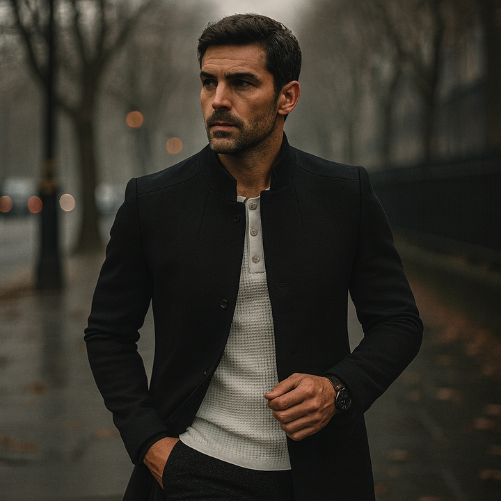 Full-length shot of a man in a minimalist button winter coat, defining smart casual elegance.