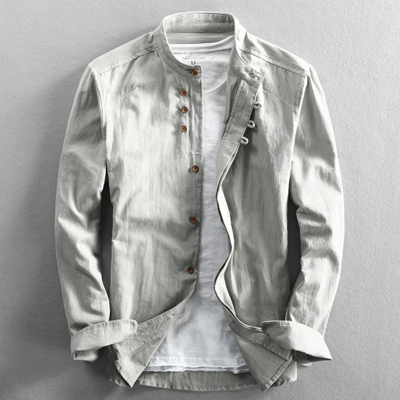 Light gray men's band collar shirt, unbuttoned, styled for versatile casual summer and spring outfits.