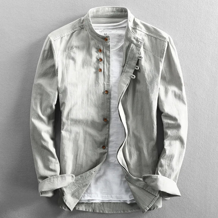 Light gray men's band collar shirt, unbuttoned, styled for versatile casual summer and spring outfits.