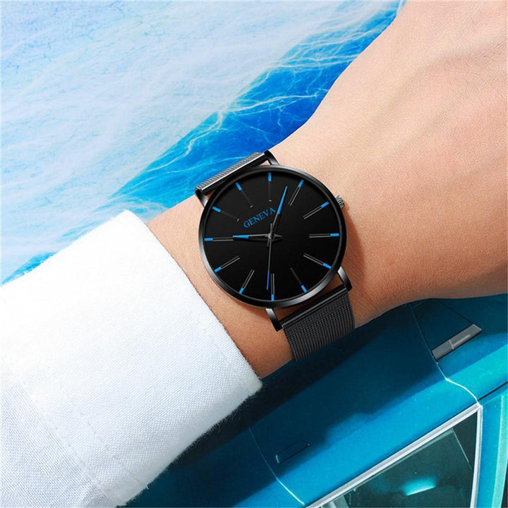 New men's quartz analog watch, minimalist design with a sleek black dial & subtle blue accents.