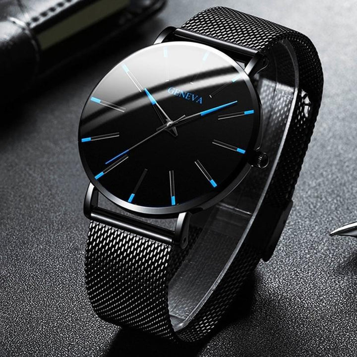 Contemporary men's wrist watch, minimalist aesthetic, blue accented hands, and dependable quartz movement.