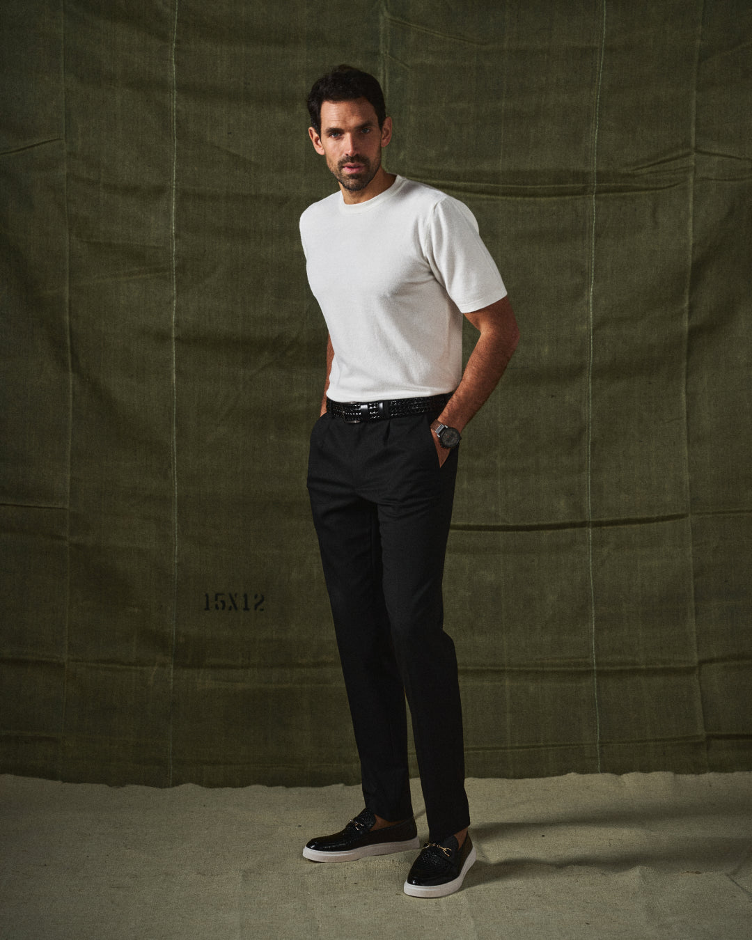Man wearing stylish modern brown slip-on loafers with a smart casual outfit.