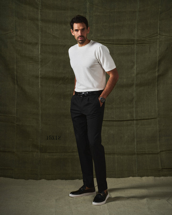 Man wearing stylish modern brown slip-on loafers with a smart casual outfit.